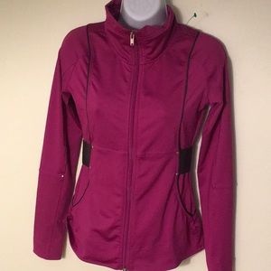 NWOT Reebok zip up jacket with belt, size small.